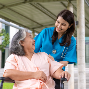 In-home nursing care with licensed nurse assisting elderly woman